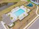Community pool with lounge chairs and playground nearby at 6609 114Th E Ave, Parrish, FL 34219