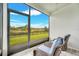 Peaceful screened porch overlooking backyard at 6609 114Th E Ave, Parrish, FL 34219