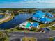 Aerial view of waterfront community with pool and lush landscaping at 829 Audubon Dr # 829, Bradenton, FL 34209