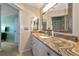 Bathroom with granite countertop and updated vanity at 829 Audubon Dr # 829, Bradenton, FL 34209