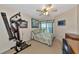 Bedroom with home gym and private balcony at 829 Audubon Dr # 829, Bradenton, FL 34209