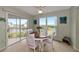 Bright dining area with water views and white table at 829 Audubon Dr # 829, Bradenton, FL 34209