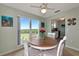 Bright dining room with table, chairs, and water views at 829 Audubon Dr # 829, Bradenton, FL 34209