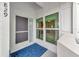 Condo entryway with door, screen, and window showing a glimpse inside at 829 Audubon Dr # 829, Bradenton, FL 34209