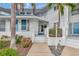 Condo entrance with walkway, landscaping, and white building exterior at 829 Audubon Dr # 829, Bradenton, FL 34209
