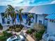Charming waterfront homes with blue roofs and tropical landscaping at 829 Audubon Dr # 829, Bradenton, FL 34209