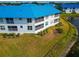 Waterfront home with blue metal roof and lush landscaping at 829 Audubon Dr # 829, Bradenton, FL 34209