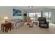 Living room with water views, comfy seating and large windows at 829 Audubon Dr # 829, Bradenton, FL 34209