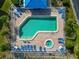 Community pool with hot tub, surrounded by lounge chairs at 829 Audubon Dr # 829, Bradenton, FL 34209
