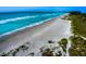 Aerial view of beach with white sand and turquoise water at 8303 Deerbrook Cir, Sarasota, FL 34238