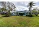 Spacious backyard with a large pool and screened enclosure at 8303 Deerbrook Cir, Sarasota, FL 34238