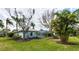 Backyard view, showcasing a pool and screened enclosure at 8303 Deerbrook Cir, Sarasota, FL 34238