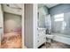 Clean bathroom with a white vanity and tub shower combo at 8303 Deerbrook Cir, Sarasota, FL 34238