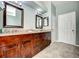Double vanity bathroom with granite countertop and ample storage at 8303 Deerbrook Cir, Sarasota, FL 34238