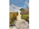 Scenic beach access path lined with lush vegetation at 8303 Deerbrook Cir, Sarasota, FL 34238