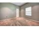 Bright bedroom with neutral walls and carpet at 8303 Deerbrook Cir, Sarasota, FL 34238