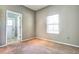 Bedroom with access to a bathroom and exterior access at 8303 Deerbrook Cir, Sarasota, FL 34238