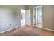 Well-lit bedroom with access to a bathroom and hallway at 8303 Deerbrook Cir, Sarasota, FL 34238