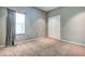 Spacious bedroom with neutral walls and carpet at 8303 Deerbrook Cir, Sarasota, FL 34238