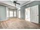 Bright bedroom with neutral walls, carpet, ceiling fan, and window seat at 8303 Deerbrook Cir, Sarasota, FL 34238