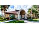 Community center building with stucco exterior and tile roof at 8303 Deerbrook Cir, Sarasota, FL 34238