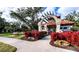 Community entrance with attractive landscaping and gated access at 8303 Deerbrook Cir, Sarasota, FL 34238