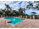 Inviting community pool with surrounding lounge chairs at 8303 Deerbrook Cir, Sarasota, FL 34238