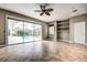 Gathering room with pool view, tile floors, and sliding glass doors at 8303 Deerbrook Cir, Sarasota, FL 34238