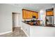 Kitchen with wood cabinets, granite countertop, and stainless steel appliances at 8303 Deerbrook Cir, Sarasota, FL 34238