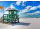 Green lifeguard stand on a pristine beach at 8303 Deerbrook Cir, Sarasota, FL 34238