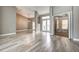 Spacious living area with light wood-look tile flooring and a view of the backyard at 8303 Deerbrook Cir, Sarasota, FL 34238