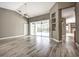 Open living space featuring neutral walls, tile flooring, and access to the backyard at 8303 Deerbrook Cir, Sarasota, FL 34238