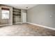 Spacious office with tile flooring, built-in shelving, and large window at 8303 Deerbrook Cir, Sarasota, FL 34238