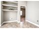 Home office with built-in shelves and tile flooring at 8303 Deerbrook Cir, Sarasota, FL 34238