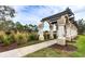 Arch-style pergola walkway with landscaping and lighting at 8303 Deerbrook Cir, Sarasota, FL 34238