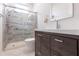 Modern bathroom with a large shower and dark wood vanity at 96 Tall Trees Ct, Sarasota, FL 34232