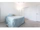 Cozy bedroom with light blue bedding and double door closet at 96 Tall Trees Ct, Sarasota, FL 34232