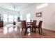 Small dining area with red leather chairs and a glass table at 96 Tall Trees Ct, Sarasota, FL 34232