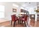 Small dining area with red leather chairs and a glass table at 96 Tall Trees Ct, Sarasota, FL 34232