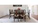 Elegant dining room with glass-top table and six chairs at 96 Tall Trees Ct, Sarasota, FL 34232
