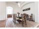 Bright dining room featuring a glass-top table and hardwood floors at 96 Tall Trees Ct, Sarasota, FL 34232