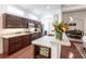 Kitchen with dark wood cabinets, stainless steel appliances, and granite countertops at 96 Tall Trees Ct, Sarasota, FL 34232