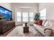 Bright living room with hardwood floors, comfy seating, and large windows at 96 Tall Trees Ct, Sarasota, FL 34232