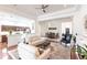 Open living space with hardwood floors, white walls, and a fireplace at 96 Tall Trees Ct, Sarasota, FL 34232
