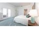 Primary bedroom with double doors leading to outdoor access at 96 Tall Trees Ct, Sarasota, FL 34232