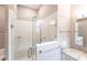 Walk-in shower with grab bars and updated tile at 96 Tall Trees Ct, Sarasota, FL 34232