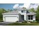 Single-story home with a two-car garage and attractive landscaping at 10133 Silent Night Ln, Sarasota, FL 34241