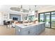 Open kitchen features a large island and views into the living room at 10160 Silent Night Ln, Sarasota, FL 34241