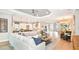 Open concept living room with kitchen view and hardwood floors at 10160 Silent Night Ln, Sarasota, FL 34241