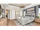 Spacious main bedroom with ensuite bathroom and large windows at 10160 Silent Night Ln, Sarasota, FL 34241
